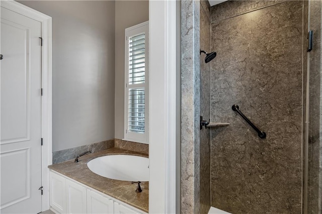 bathroom featuring shower with separate bathtub