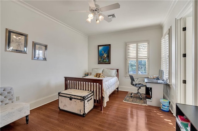 bedroom with dark wood-type flooring, ceiling fan, and crown molding