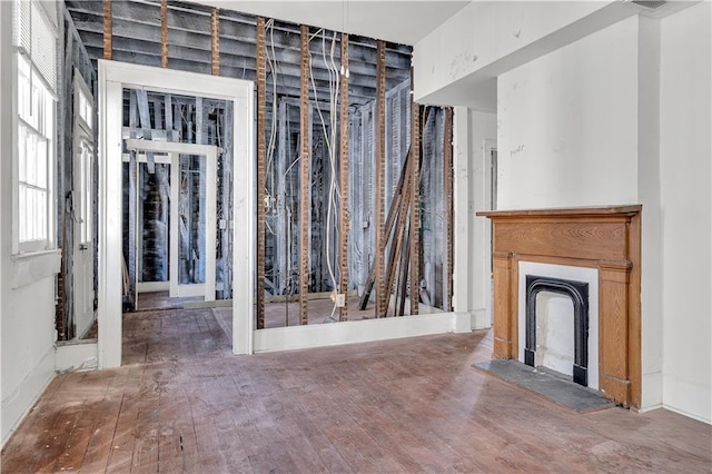 unfurnished living room featuring hardwood / wood-style flooring