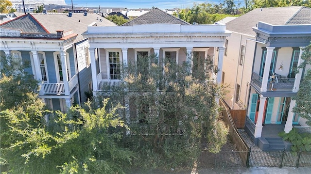 view of side of property with a balcony