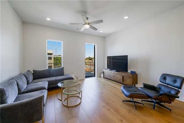 living room featuring recessed lighting, a ceiling fan, and hardwood / wood-style flooring