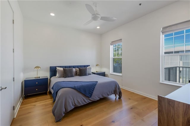 bedroom featuring recessed lighting, baseboards, and light wood-style floors