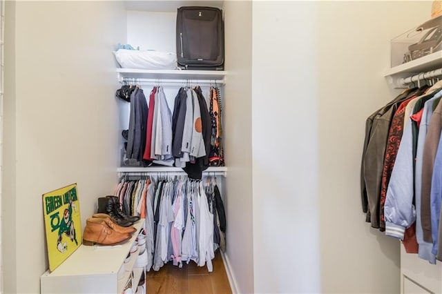 spacious closet with wood finished floors