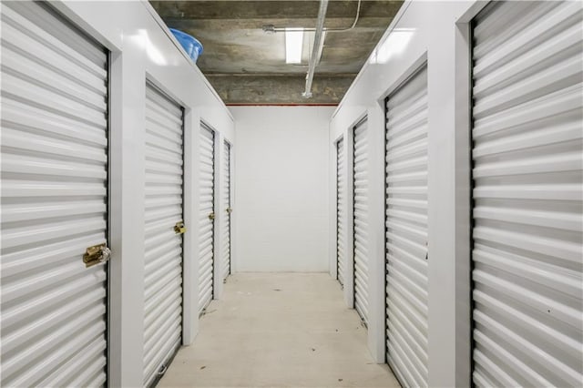 hallway with concrete flooring