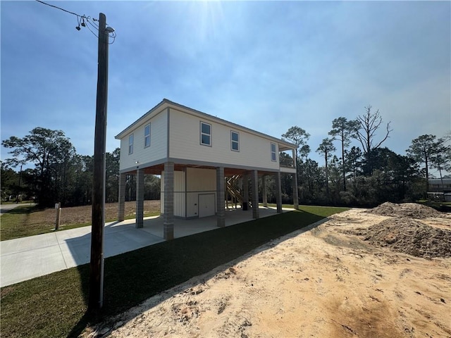 view of home's exterior featuring a carport and driveway