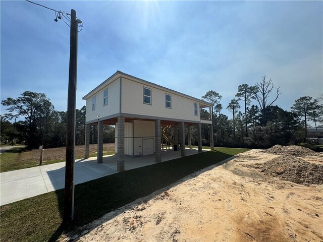 5019 Colorado St, Bay Saint Louis, MS 39520 - view of home's exterior featuring a carport and driveway