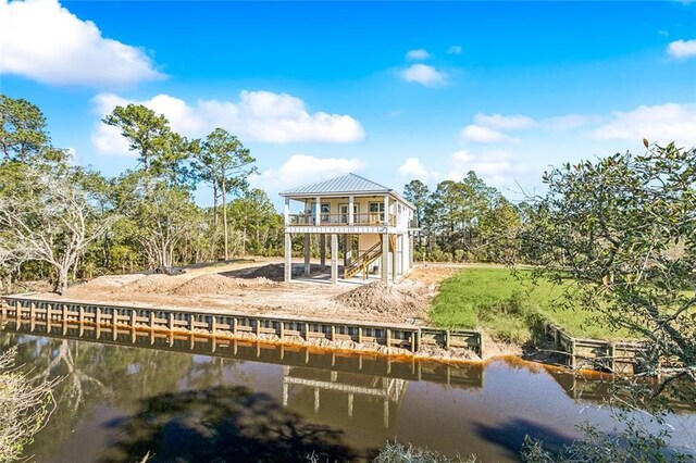 5019 Colorado St, Bay Saint Louis, MS 39520 - rear view of house with a balcony and a water view