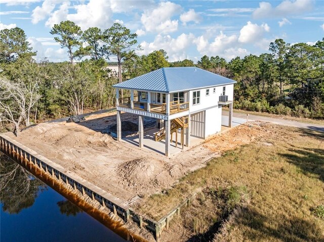 5019 Colorado St, Bay Saint Louis, MS 39520 - rear view of property with metal roof and a water view