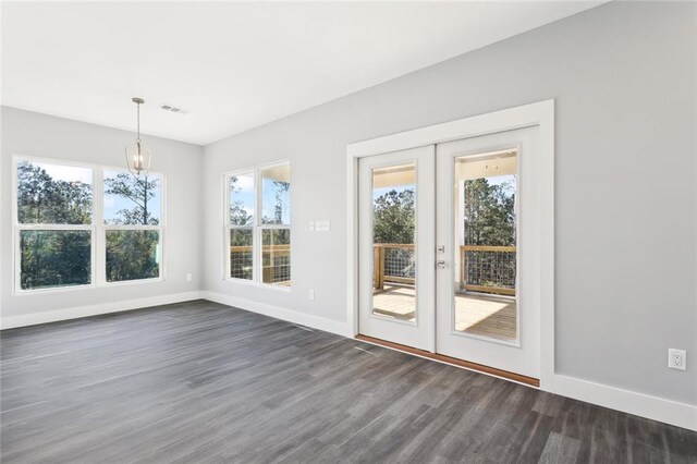 5019 Colorado St, Bay Saint Louis, MS 39520 - unfurnished dining area with dark wood finished floors, a healthy amount of sunlight, french doors, and baseboards