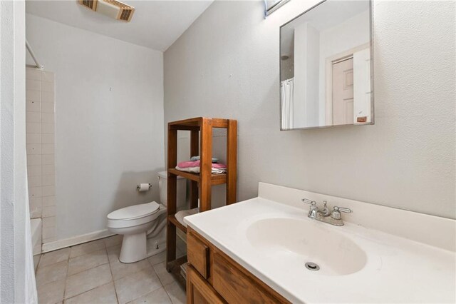 1135 Ursulines Ave, New Orleans, LA 70116 - full bathroom with vanity, toilet, shower / washtub combination, and tile patterned flooring