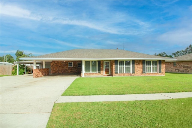 single story home featuring a carport and a front yard