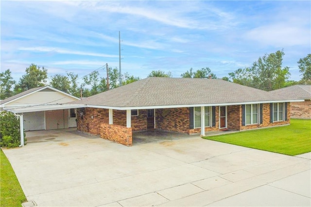 ranch-style house with a front yard and a carport