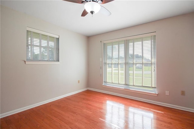 unfurnished room with light hardwood / wood-style flooring and ceiling fan