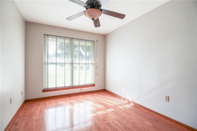 unfurnished room featuring light hardwood / wood-style flooring and ceiling fan