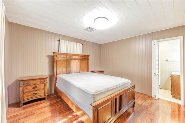 208 R J Dr, Chauvin, LA 70344 - bedroom with light wood-style flooring and visible vents