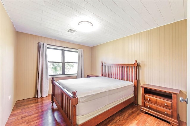 208 R J Dr, Chauvin, LA 70344 - bedroom with wood finished floors and visible vents