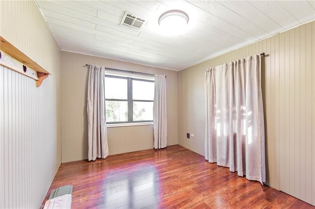 208 R J Dr, Chauvin, LA 70344 - spare room with hardwood / wood-style floors and visible vents