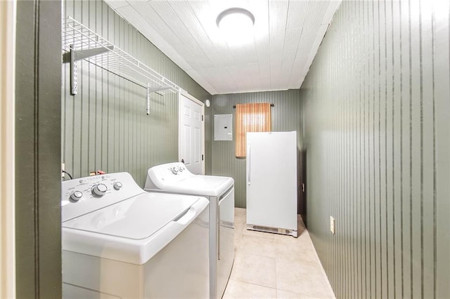 208 R J Dr, Chauvin, LA 70344 - laundry room with light tile patterned flooring, electric panel, laundry area, and independent washer and dryer