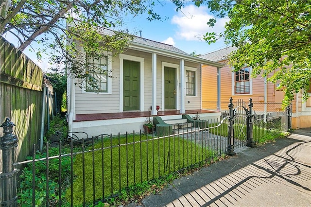 bungalow-style house featuring a front yard and a porch