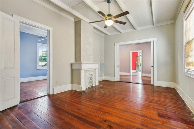 unfurnished living room with beam ceiling, a fireplace, dark hardwood / wood-style floors, and ceiling fan