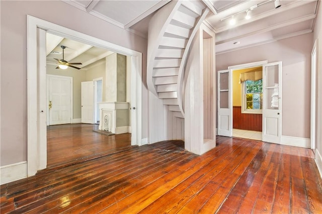 entryway featuring dark hardwood / wood-style floors, rail lighting, beamed ceiling, and ceiling fan