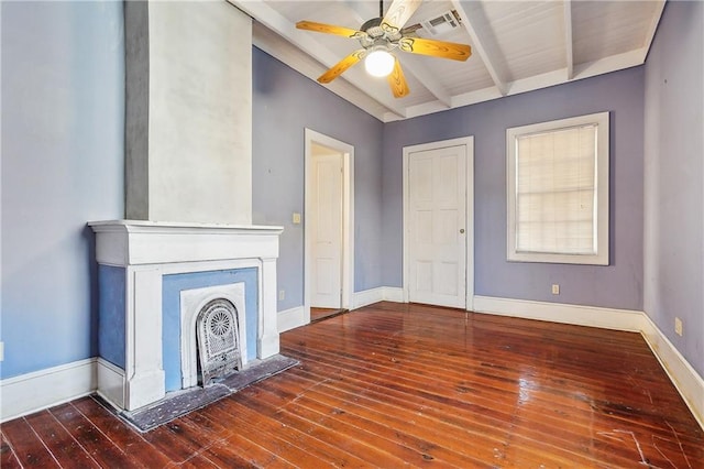 unfurnished living room featuring ceiling fan, lofted ceiling with beams, and hardwood / wood-style floors