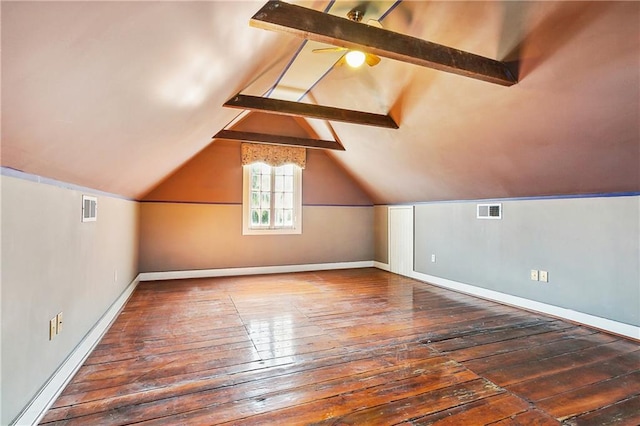 additional living space featuring dark wood-type flooring, vaulted ceiling with beams, and ceiling fan