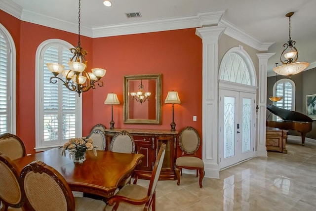 dining space featuring a wealth of natural light, ornamental molding, french doors, and a notable chandelier