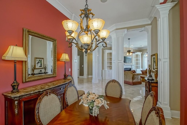 dining room with ornate columns, ornamental molding, and ceiling fan with notable chandelier