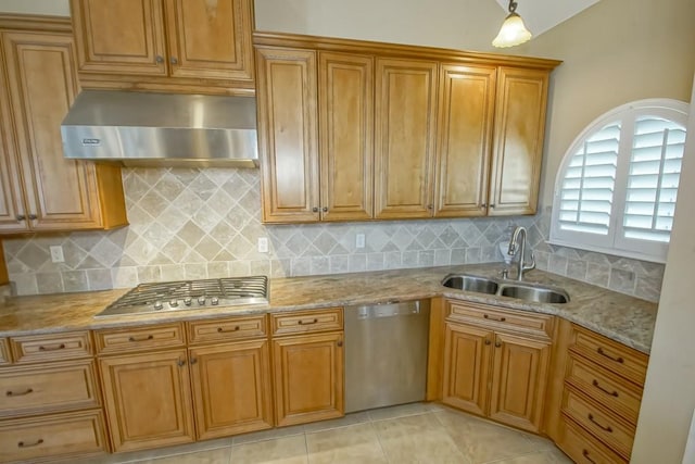 kitchen with sink, appliances with stainless steel finishes, exhaust hood, and decorative backsplash