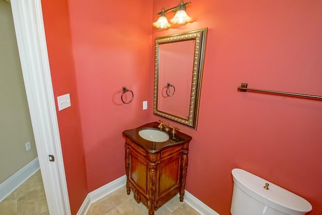 bathroom with vanity, toilet, and tile patterned floors