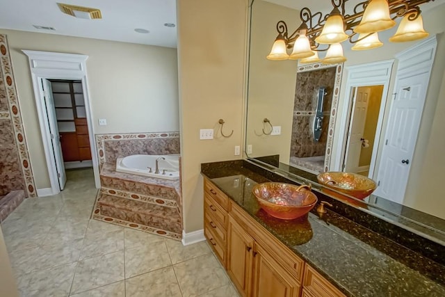 bathroom with vanity, shower with separate bathtub, a chandelier, and tile patterned flooring