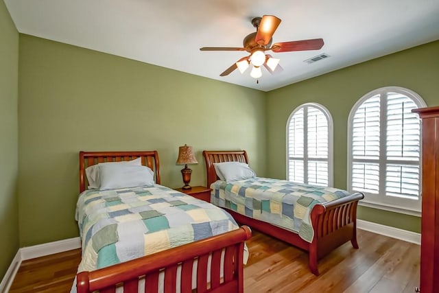 bedroom featuring light hardwood / wood-style flooring and ceiling fan