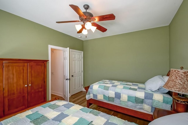 bedroom with light wood-type flooring and ceiling fan