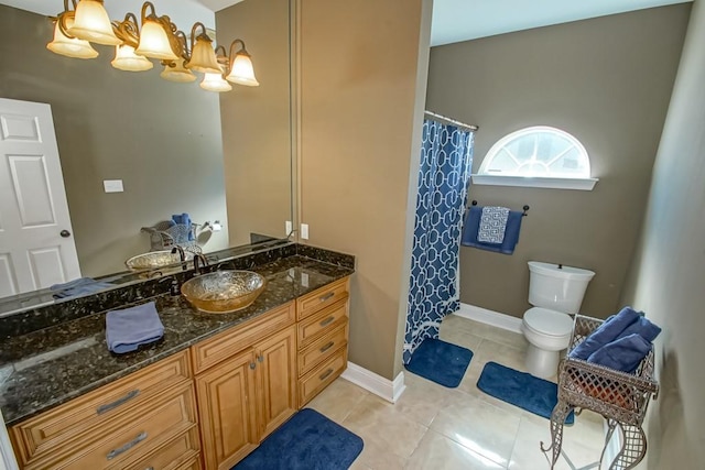 bathroom with vanity, toilet, and tile patterned flooring