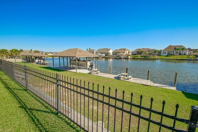 exterior space featuring a yard and a water view