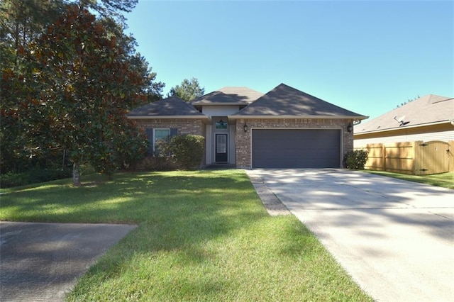 view of front of house with a front yard and a garage