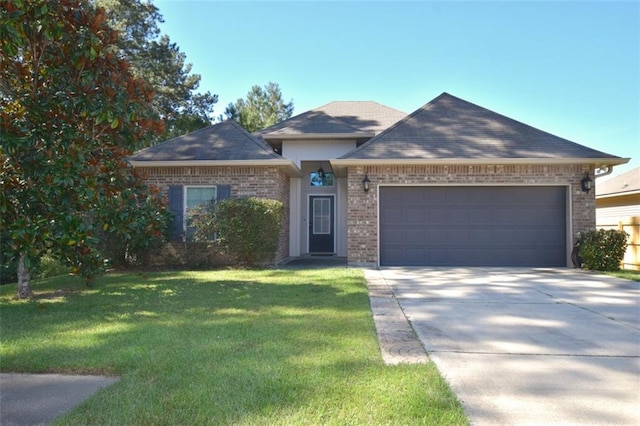 view of front facade with a garage and a front lawn