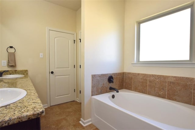 bathroom featuring a bathing tub and vanity