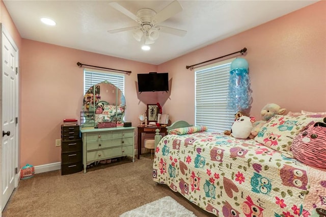 carpeted bedroom with a closet and ceiling fan