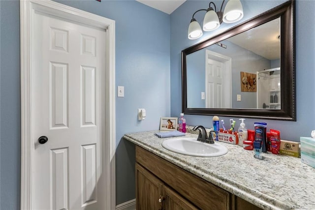 bathroom featuring vanity and a shower with shower curtain