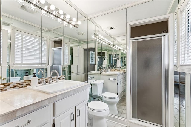 full bath with a stall shower, decorative backsplash, visible vents, and toilet