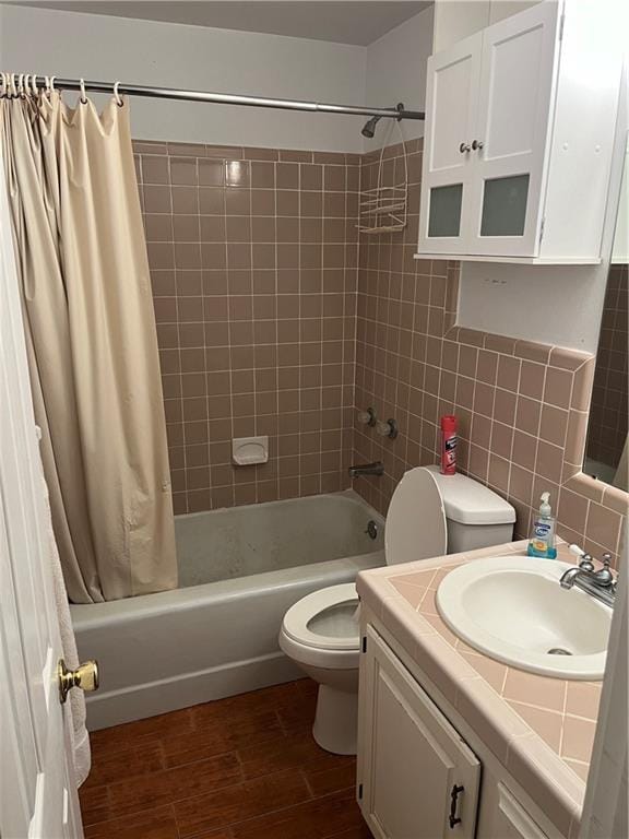 full bathroom featuring wood-type flooring, backsplash, toilet, vanity, and shower / tub combo with curtain