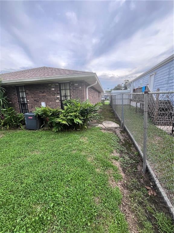 view of yard with central AC unit