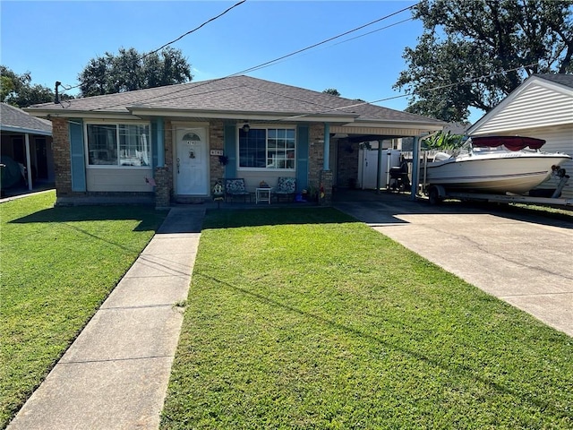 view of front facade with a front yard and a carport