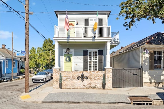 view of front of property with a balcony