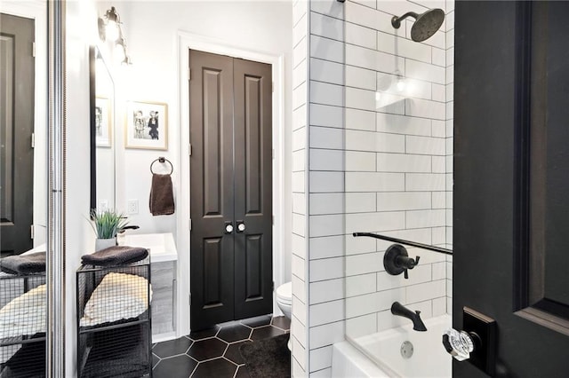 full bathroom with vanity, tiled shower / bath combo, toilet, and tile patterned flooring