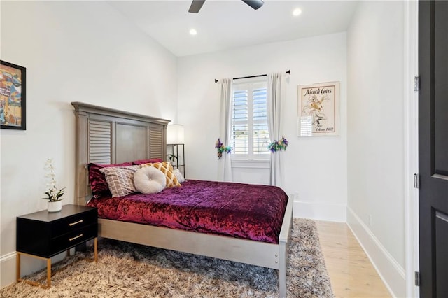 bedroom featuring hardwood / wood-style flooring and ceiling fan