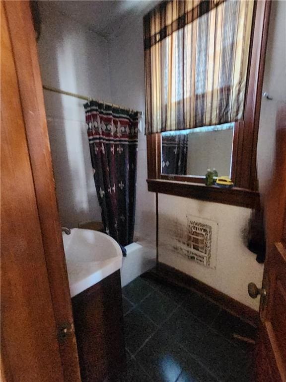 bathroom featuring vanity and a bathtub