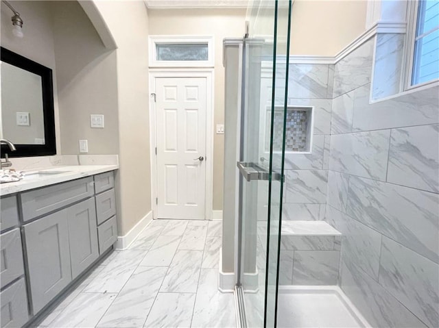 bathroom featuring vanity and an enclosed shower